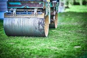 Picture of a road roller machine on the different surfaces photo