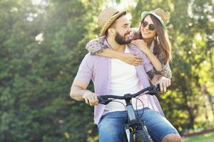 Romantic couple riding bikes photo