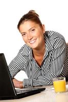 Young businesswoman working on laptop photo