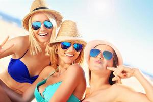 Group of women having fun on the beach photo
