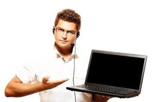 Young man with laptop photo