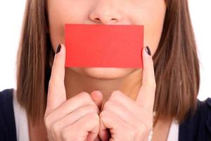 Brunette woman with blank business card photo