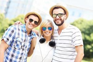 Group of friends in front of modern buildings photo