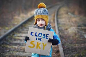 Picture of a child with a lot of love and peaceful message photo