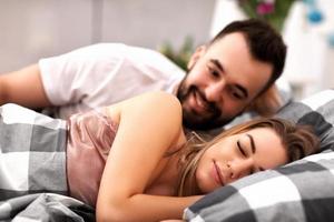 Adult attractive couple in bed photo