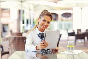 Young manager working in cafe photo