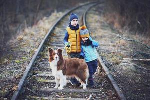 Picture of a child with a lot of love and peaceful message with dog photo