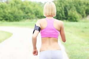 Active woman jogging in park photo