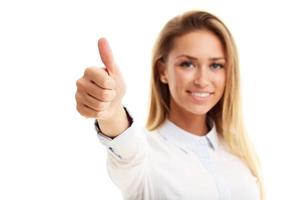 Happy woman showing ok sign over white background photo