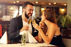 Romantic couple dating in restaurant photo