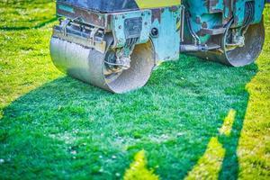 Picture of a road roller machine on the different surfaces photo