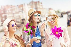 Group of girl friends having fun in the city photo