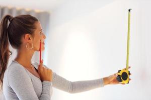 Mature woman doing home improvements photo