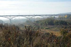 Modern bridge spanning a river, an engineering feat photo