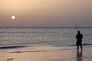 Beach shore fishing, traditional fishing as a hobby photo