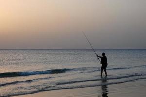 Beach shore fishing, traditional fishing as a hobby photo