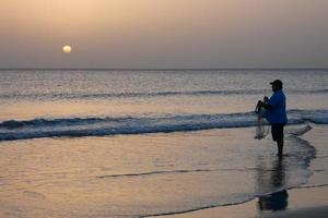 Beach shore fishing, traditional fishing as a hobby photo