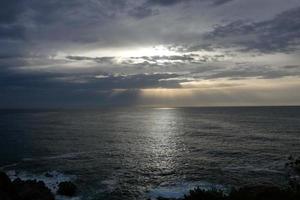 Clouds and light effects in the sky at dawn or dusk. photo