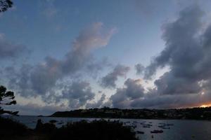 Scattered clouds in the sky indicating a change in weather. photo