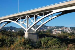 Modern bridge spanning a river, an engineering feat photo