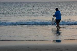 Beach shore fishing, traditional fishing as a hobby photo