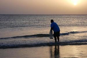 Beach shore fishing, traditional fishing as a hobby photo