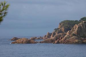 Mediterranean coastline with rocks in the catalan region, Spain photo