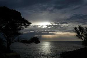 Clouds and light effects in the sky at dawn or dusk. photo