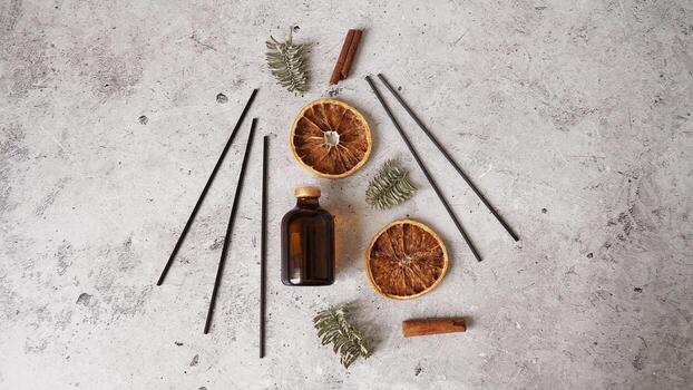 Citrus reed diffuser with cinnamon, dry orange and fir tree branches. photo