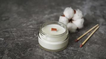 Label mockup of the glass jar with handmade candle with a wooden wick photo