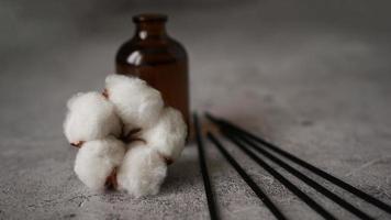 Aroma diffuser with cotton. Aromatherapy on a dark marble background. photo