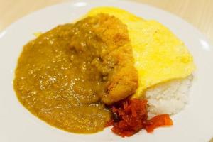Japanese curry rice in close-up on white plate with blurred background photo