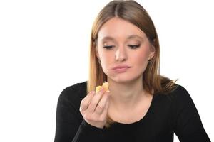 portrait of a beautiful funny young girl eating hamburger photo