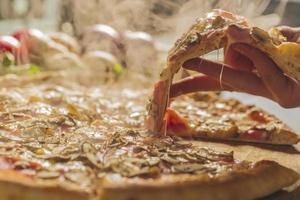 Fresh baked pizza with melted cheese photo