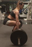 Woman doing a workout at the fitness gym. photo