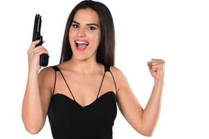 bellas mujeres peligrosas sosteniendo un arma foto
