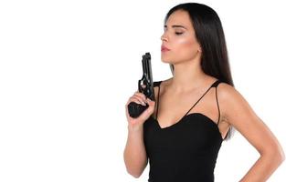beautiful dangerous women holding a gun photo