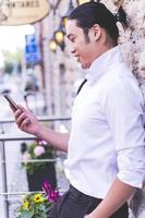 ASIAN business male model talking on his cell phone photo