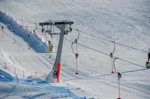 Ski slope with ski lift photo