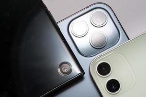 different number of cameras on smartphone. One, Two and Three Lenses Phone Camera photo