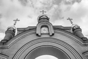 Christian church cross in high steeple tower for prayer photo