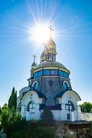 Christian church cross in high steeple tower for prayer photo