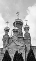 Christian church cross in high steeple tower for prayer photo