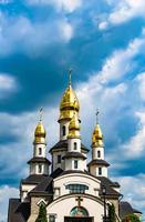 Christian church cross in high steeple tower for prayer photo