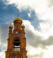 Christian church cross in high steeple tower for prayer photo