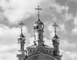 Christian church cross in high steeple tower for prayer photo