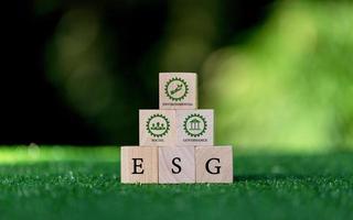 ESG concept of environmental, social and governance. words ESG on a wood cube is an idea for sustainable business organizational development. photo