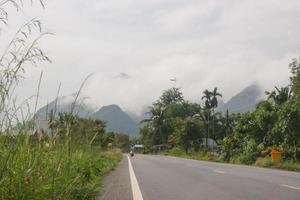 Morning mist on mountain and roads in rural Thailand photo