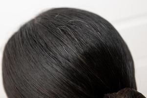 Close-up  hoary hair on woman head , health care concept photo