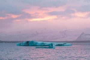 Icebergs against snowy mountains landscape photo